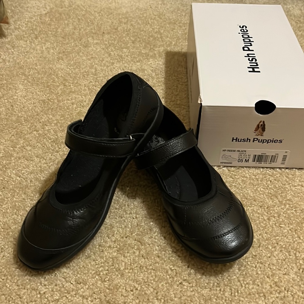 Black Mary Jane shoes.
